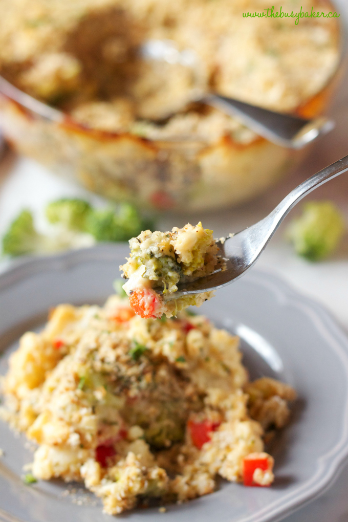 Cheesy Broccoli Cauliflower Casserole with fork and grey plate