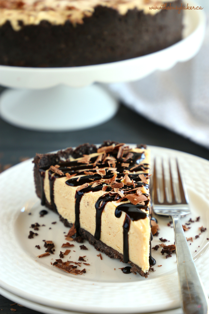 Frozen Chocolate Peanut Butter Cheesecake Pie with chocolate sauce and chocolate shavings