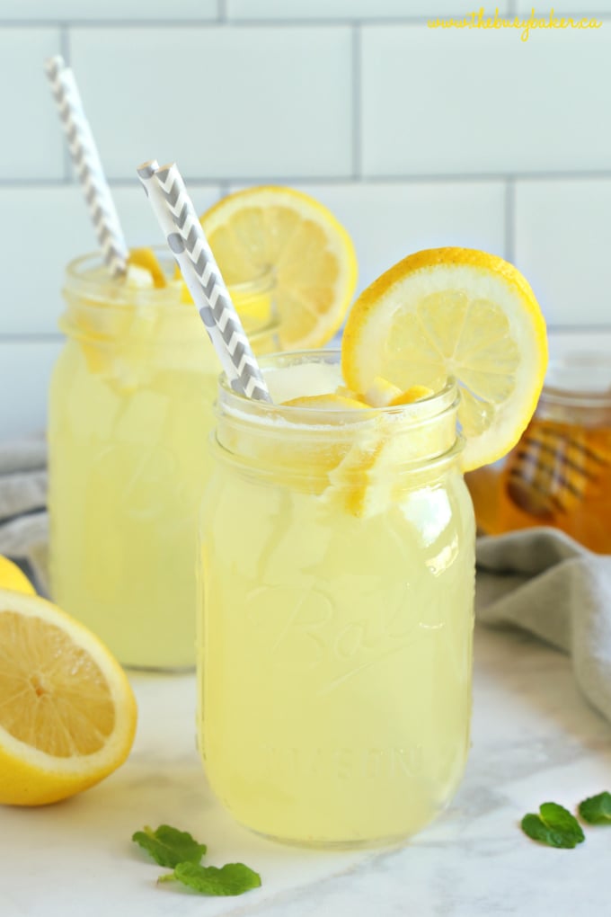 healthy homemade lemonade with honey and lemon and straws