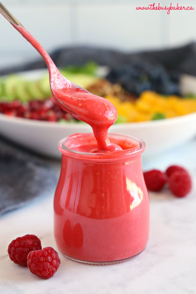 Healthy Raspberry Vinaigrette Salad Dressing with spoon and fresh raspberries