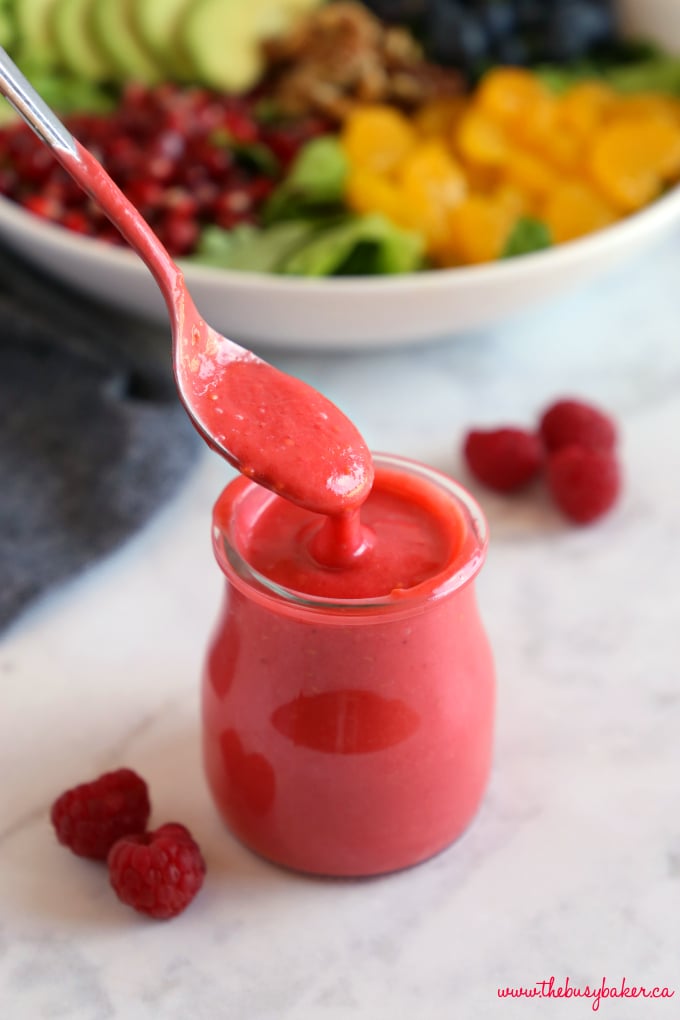 Healthy Raspberry Vinaigrette Salad Dressing with spoon and fresh raspberries