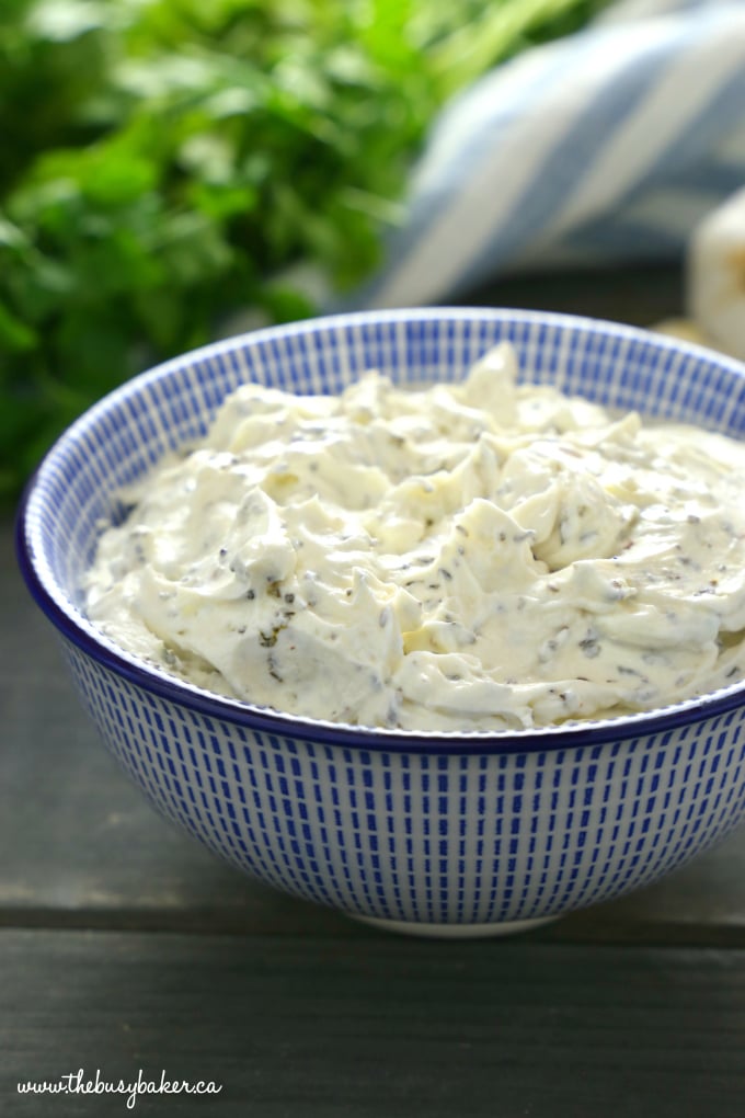 Easy Herb and Garlic Cream Cheese in blue bowl with blue striped towel