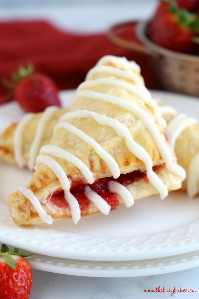 Easy Strawberry Hand Pies with strawberry filling and white drizzle icing
