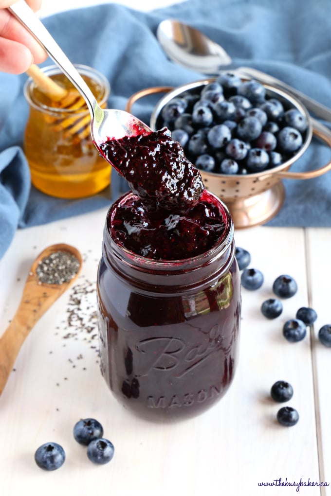 Healthy 3-Ingredient Chia Seed Blueberry Jam on spoon with honey