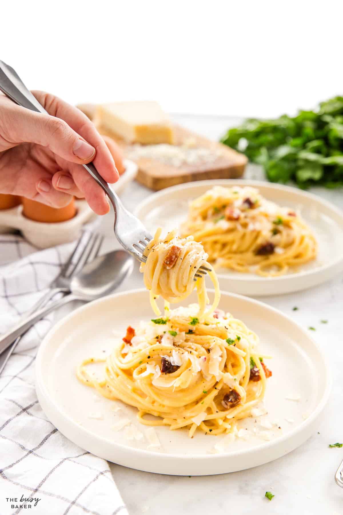 pasta carbonara on a plate with a fork