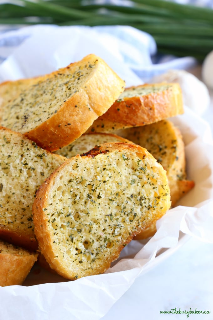 Easy Homemade Garlic Bread in basket with herbs