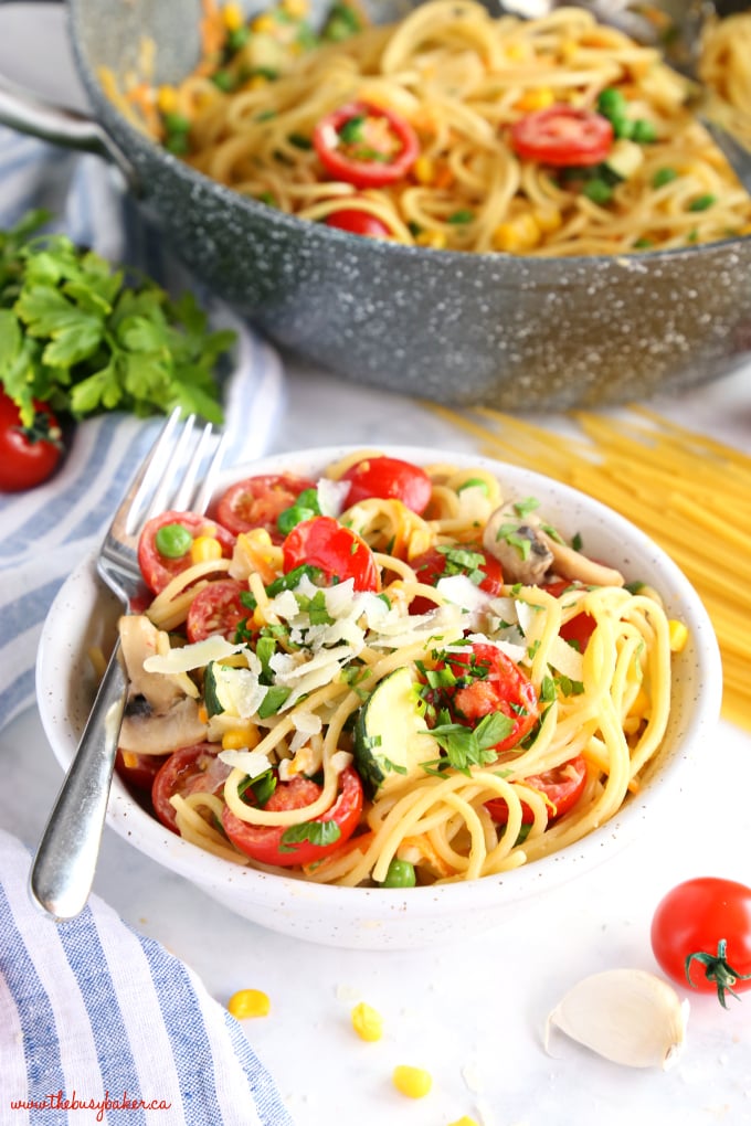 Easy One Pot Pasta Primavera with linen towel and fresh tomatoes