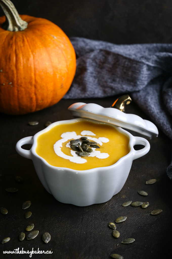 recipe for Pumpkin Soup in pumpkin bowl dark photography