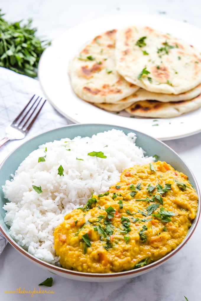 Easy One Pan Lentil Daal Curry in bowl with rice and naan bread