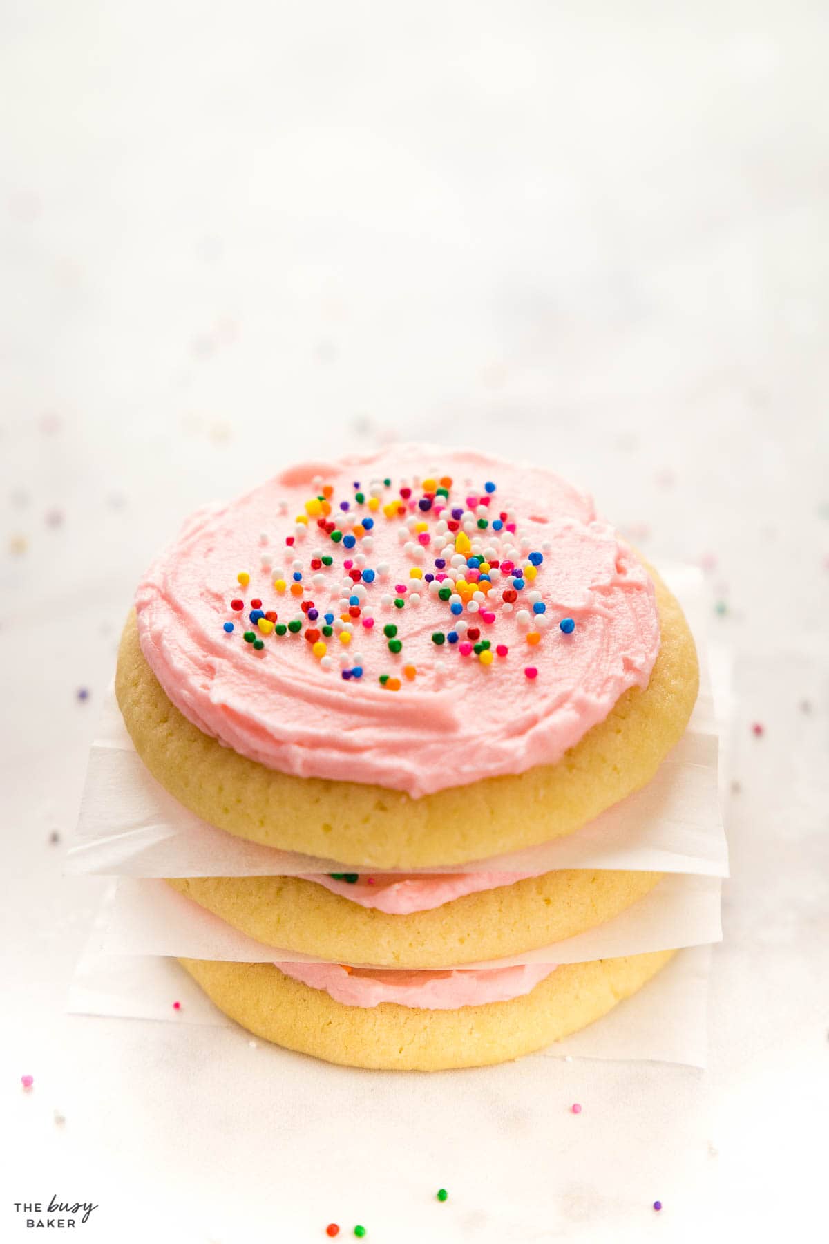 stack of lofthouse sugar cookies with pink frosting