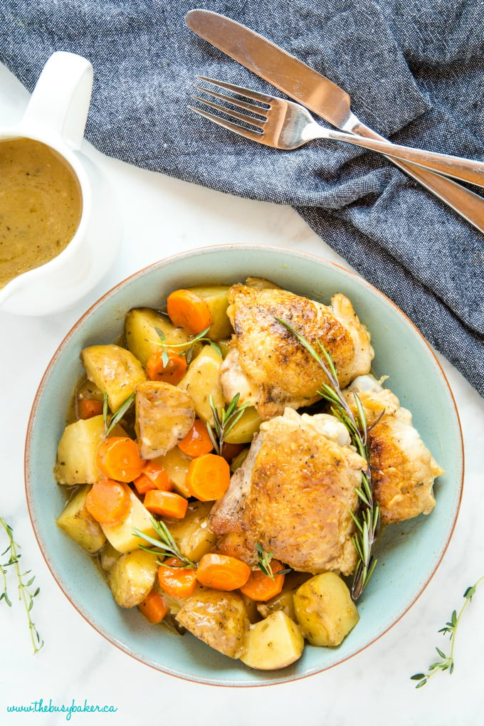Easy One Pot Roasted Chicken Dinner in turquoise bowl with fresh rosemary