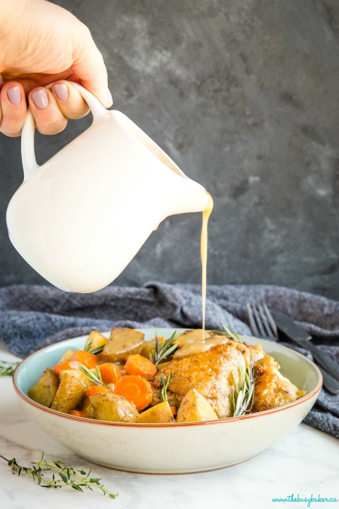 Easy One Pot Roasted Chicken Dinner with gravy pouring
