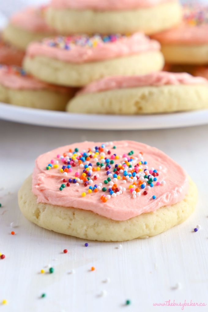 Soft and Chewy Frosted Sugar Cookie with pink frosting and sprinkles