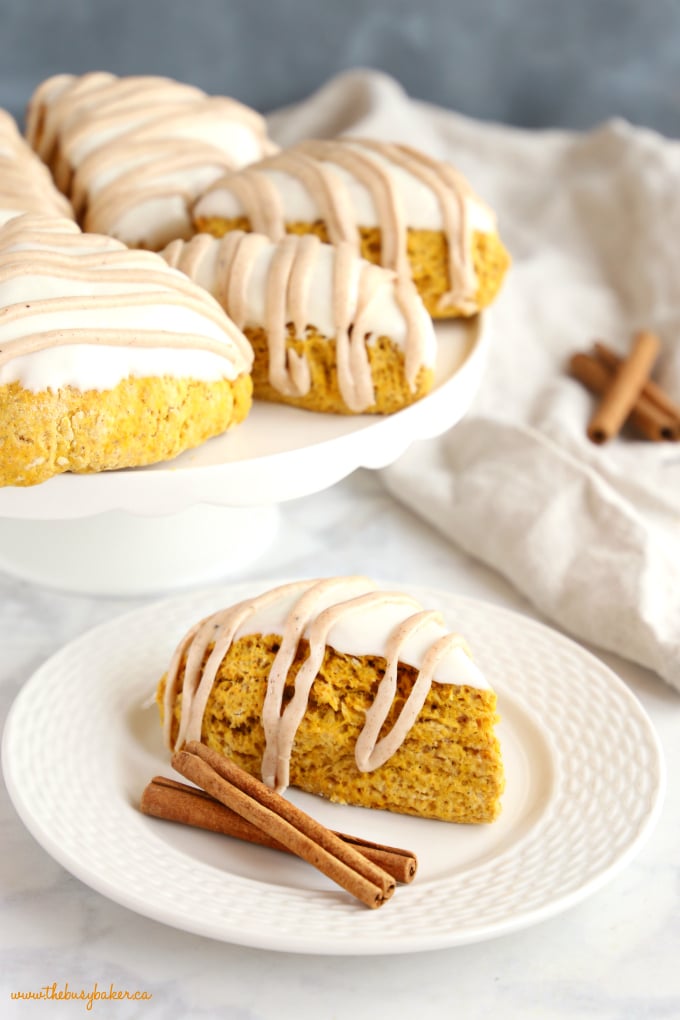 Pumpkin Scones with cinnamon sticks on white plate