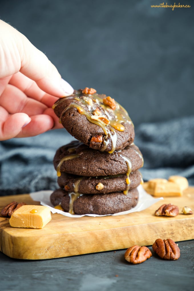 Chocolate Caramel Pecan Turtle Cookies in hand