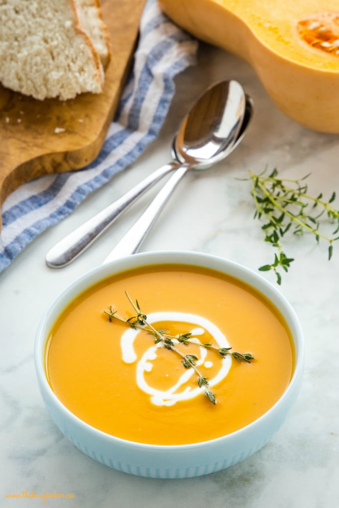 Creamy One Pot Butternut Squash Soup in blue bowl with fresh thyme
