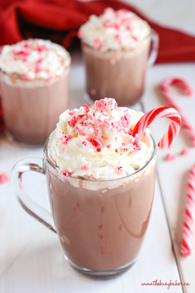 Healthier Slow Cooker Peppermint Hot Chocolate with candy canes and whipped cream