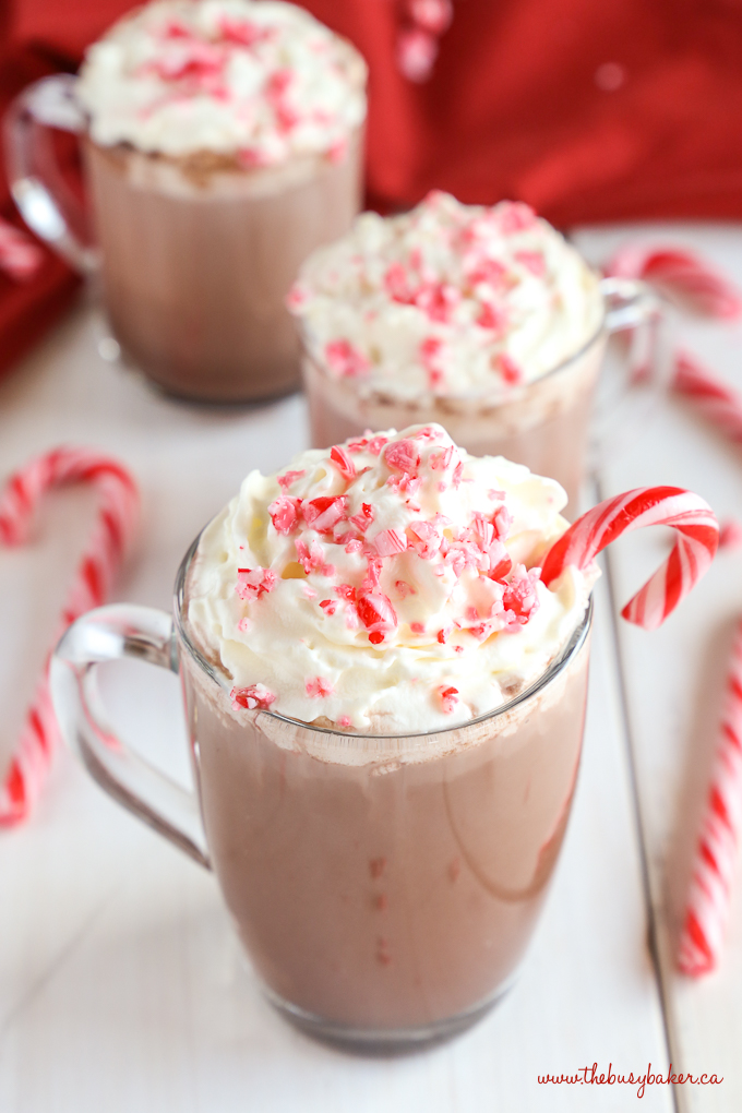 Healthier Slow Cooker Peppermint Hot Chocolate with whipped cream and candy canes