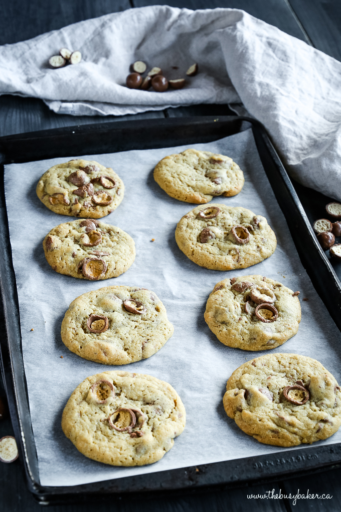 Maltesers Chocolate Chip Cookies on cookie pan with parchment paper