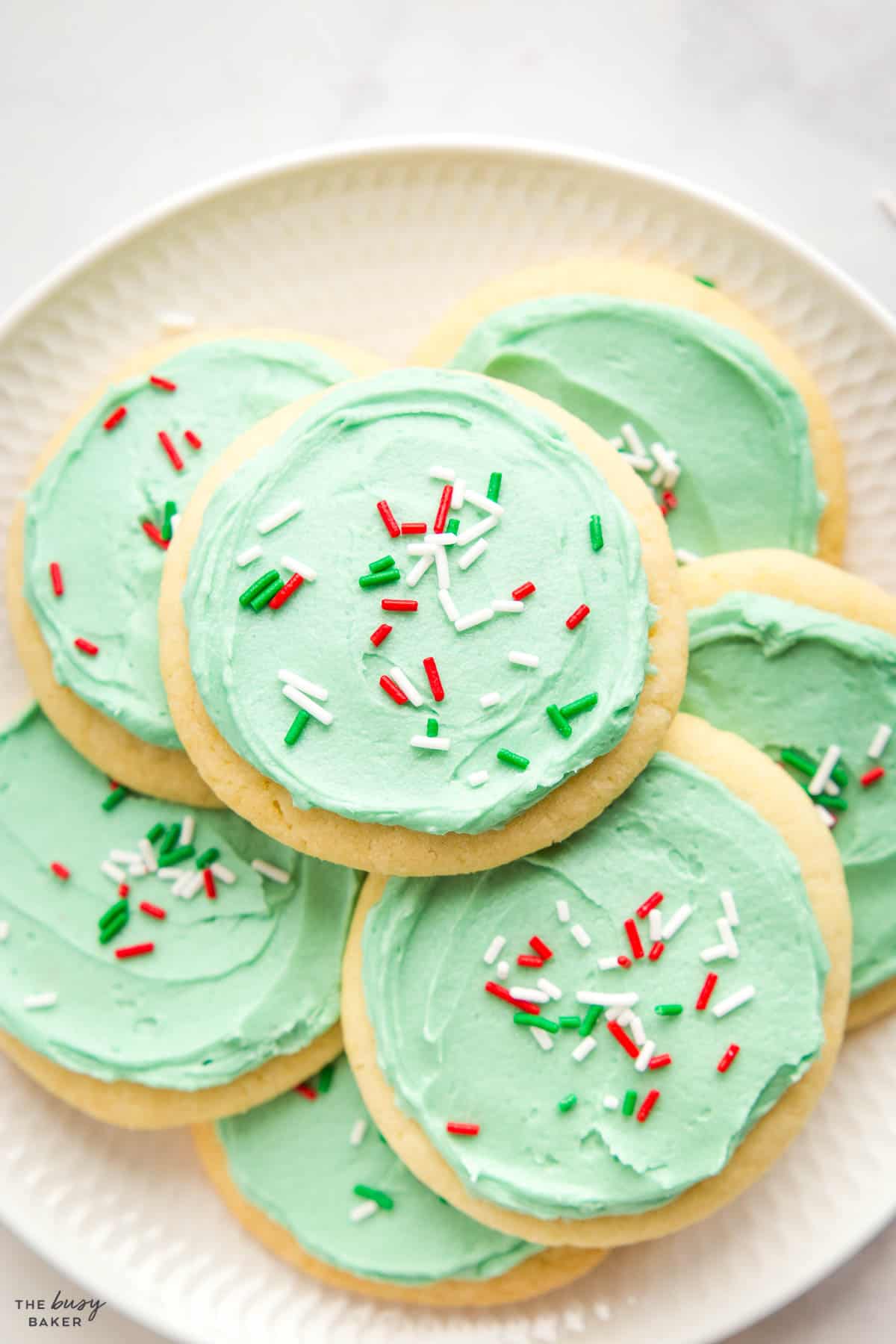 sugar cookies on plate with green frosting