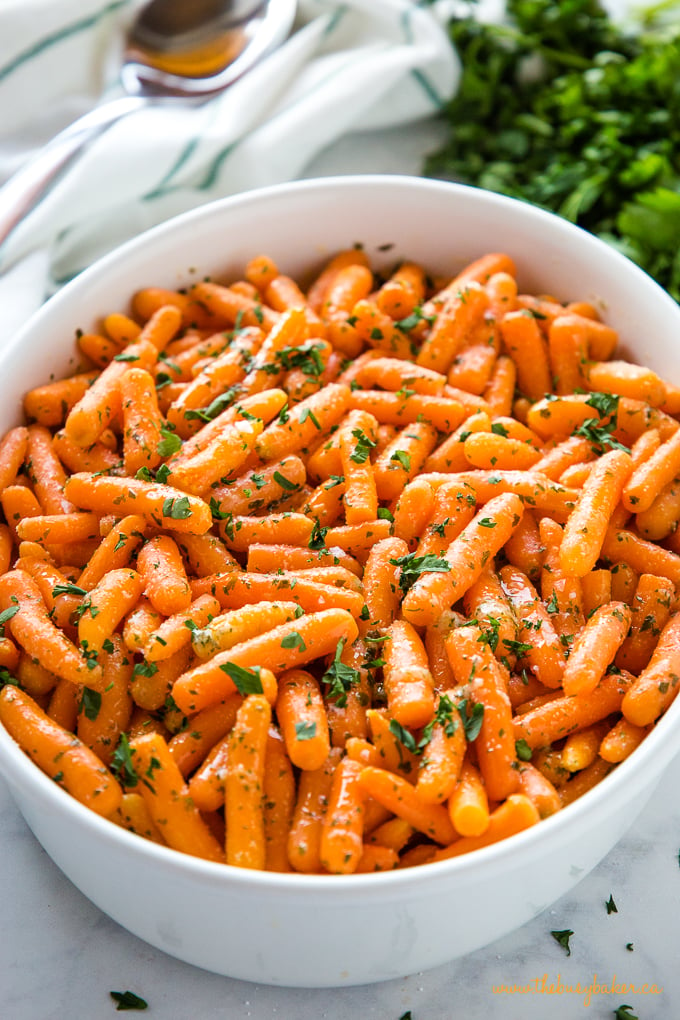 Garlic Butter Roasted Carrots in white baking dish