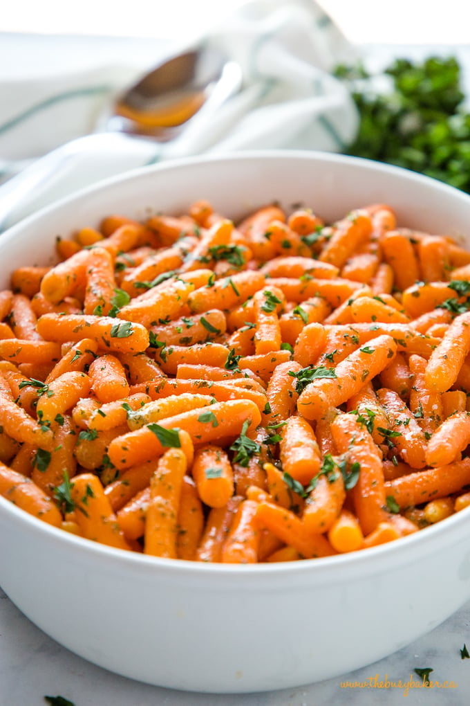 Garlic Butter Roasted Carrots in white baking dish