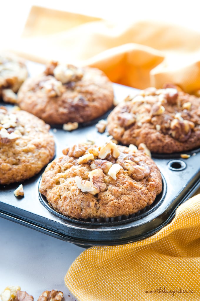 Best Ever Banana Nut Muffins in muffin tin with walnuts