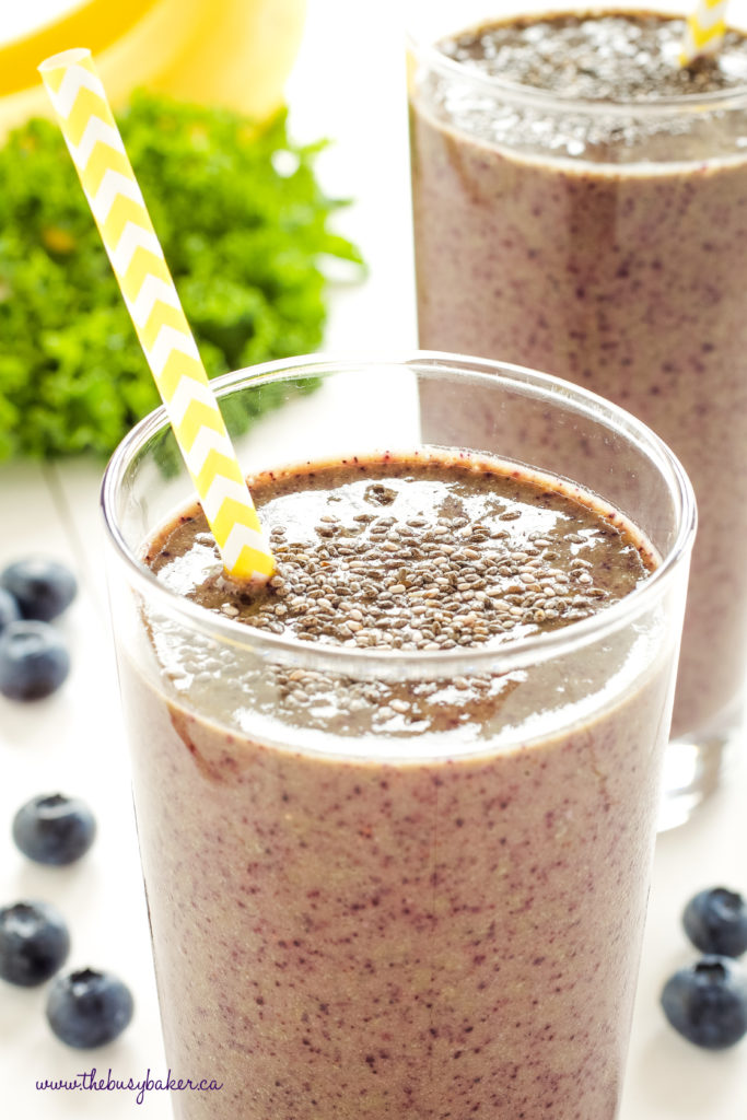 Blueberry Kale Power Smoothie with yellow paper straw