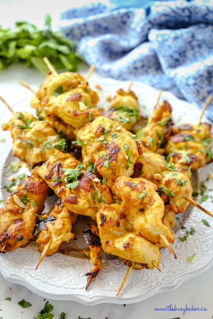 Easy Homemade Chicken Satay with Peanut Dipping Sauce skewers with herbs