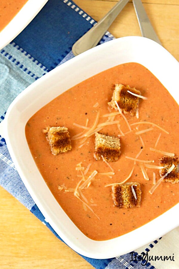 bowl of homemade creamy tomato soup with grilled cheese croutons