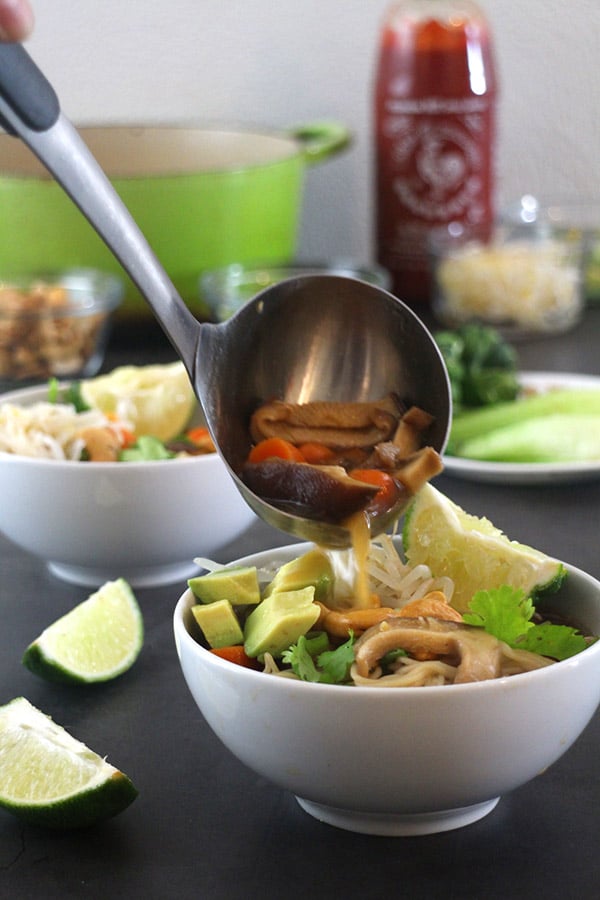 serving ladle filled with vegan ramen noodle soup