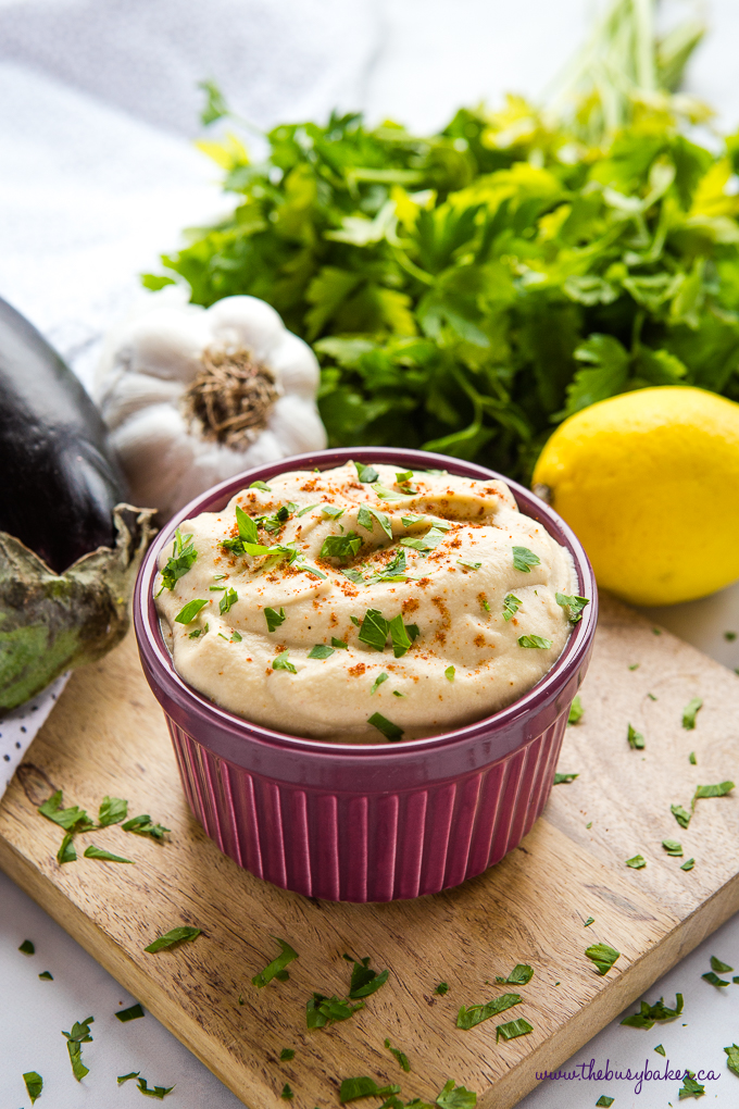 Easy Homemade Baba Ganoush in purple bowl with olive wood