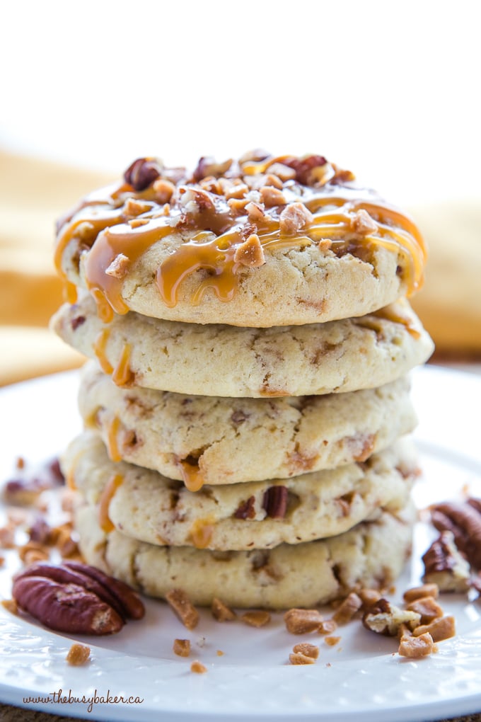 Caramel Butter Pecan Cookies in stack with caramel sauce and pecans
