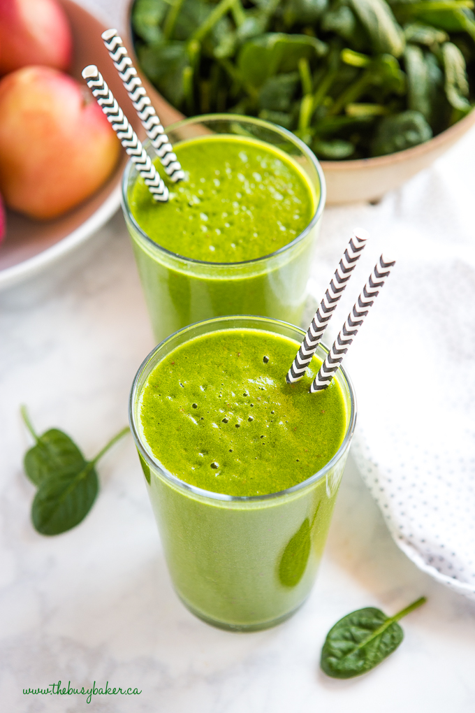 Healthy Green Protein Smoothie with paper straws, spinach and apples