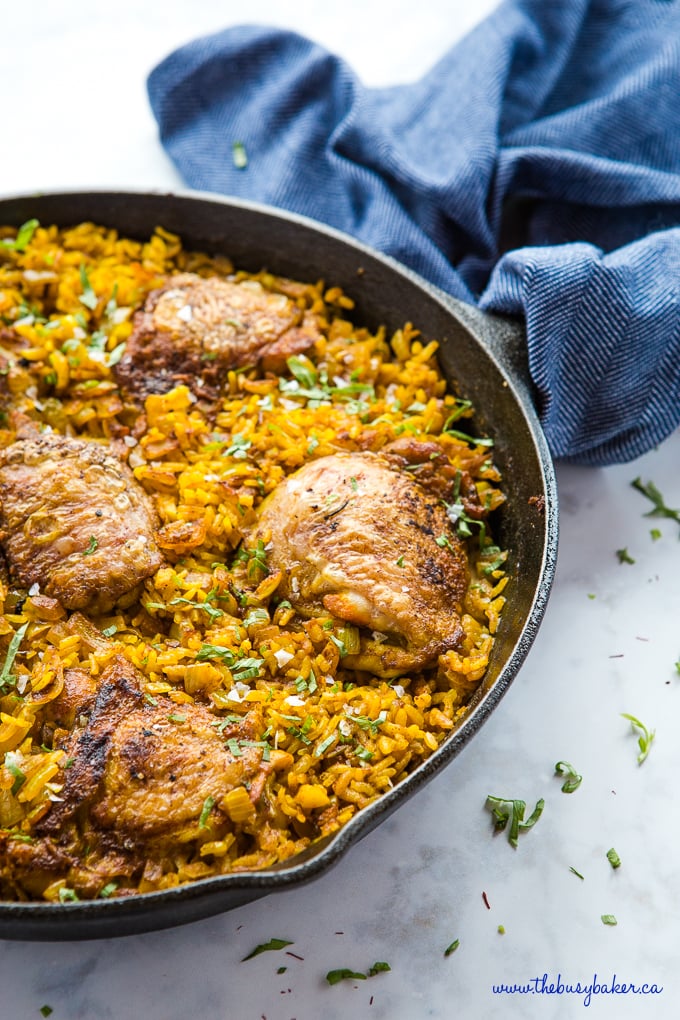 Easy One Pan Chicken with Turmeric Rice in cast iron frying pan