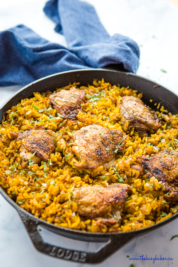 Easy One Pan Chicken with Turmeric Rice in cast iron pan