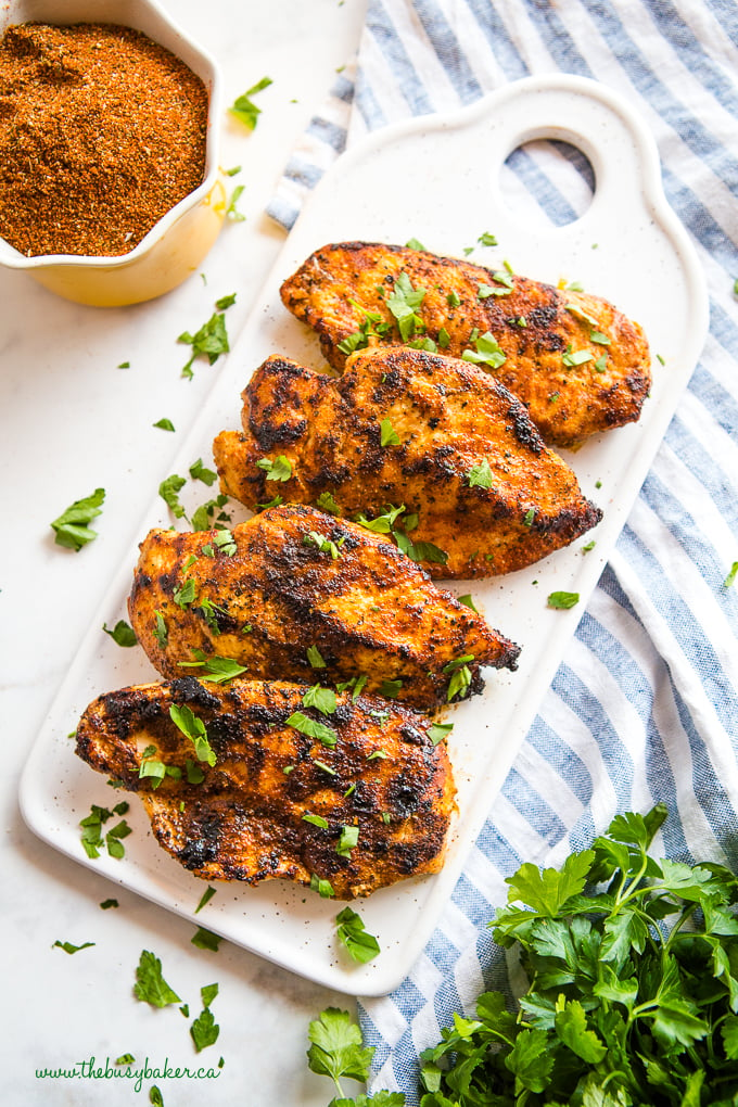 Easy Cajun Grilled Chicken on white tray with herbs