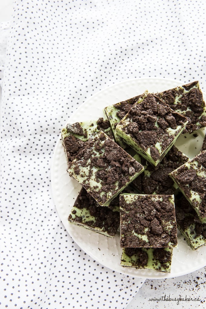 peppermint treat on white plate with Oreo crumbs