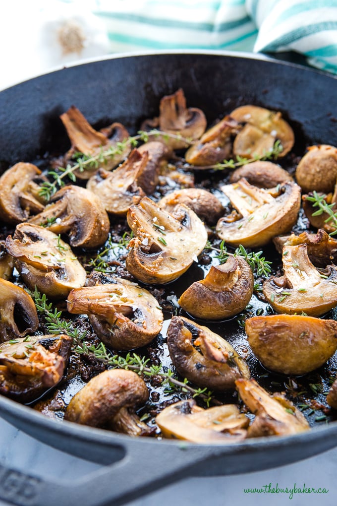 Garlic Butter Roasted Mushrooms in cast iron skillet with thyme