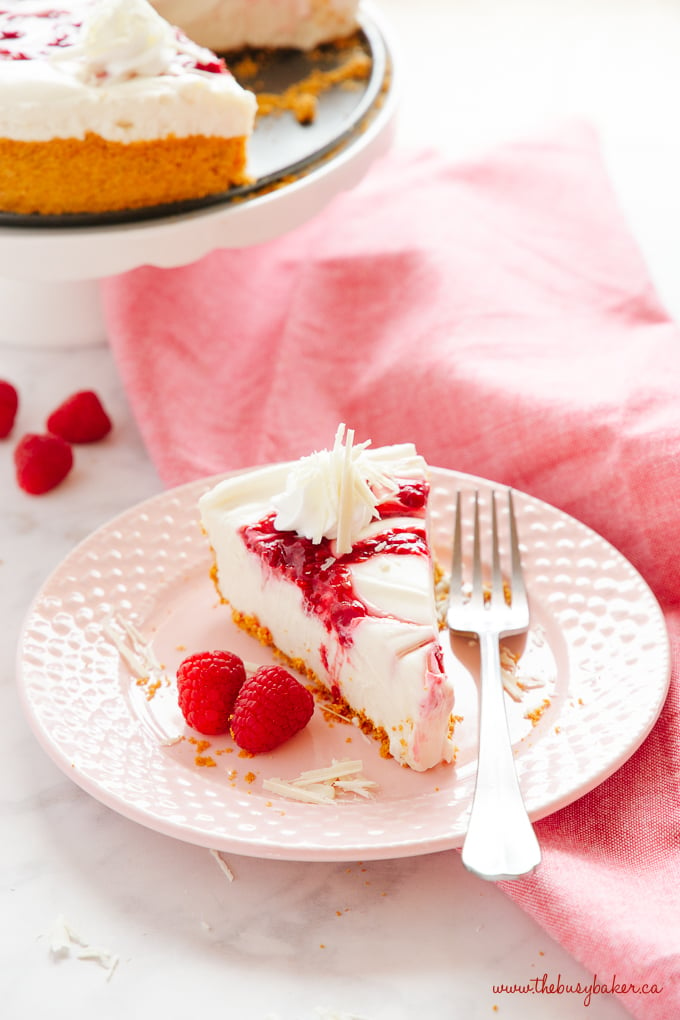 Easy No Bake White Chocolate Raspberry Cheesecake with fresh rasberries