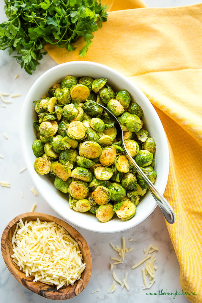 Easy Oven Roasted Brussels Sprouts in white casserole dish 