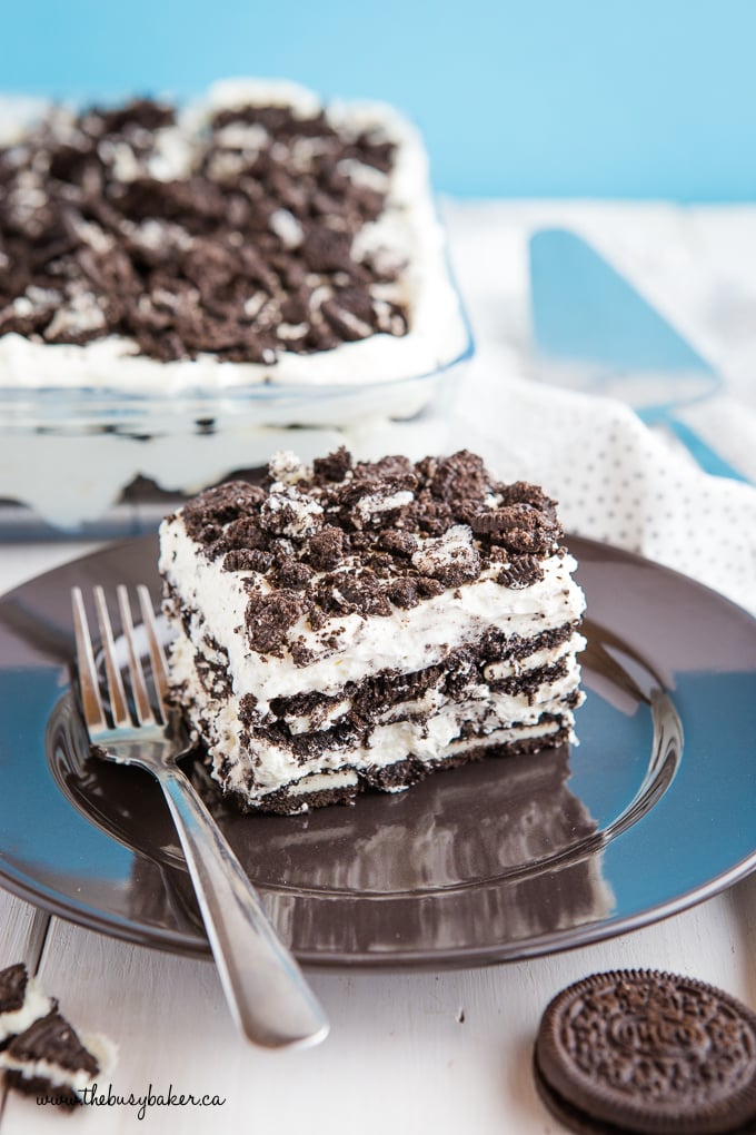 Cookies and Cream Oreo Icebox Cake on black plate with blue background