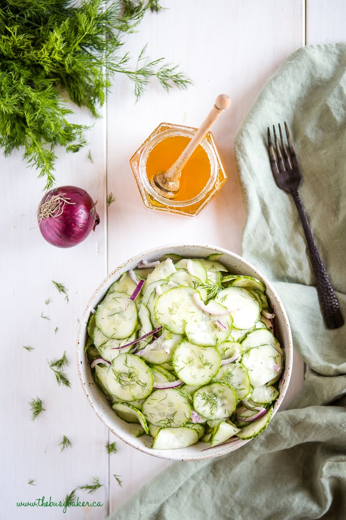 Cucumber Salad in pottery bowl with black fork