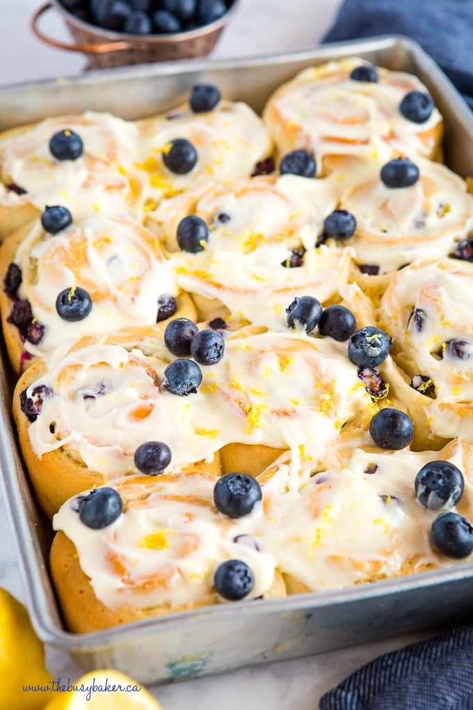 Lemon Blueberry Sweet Rolls in pan with fresh blueberries