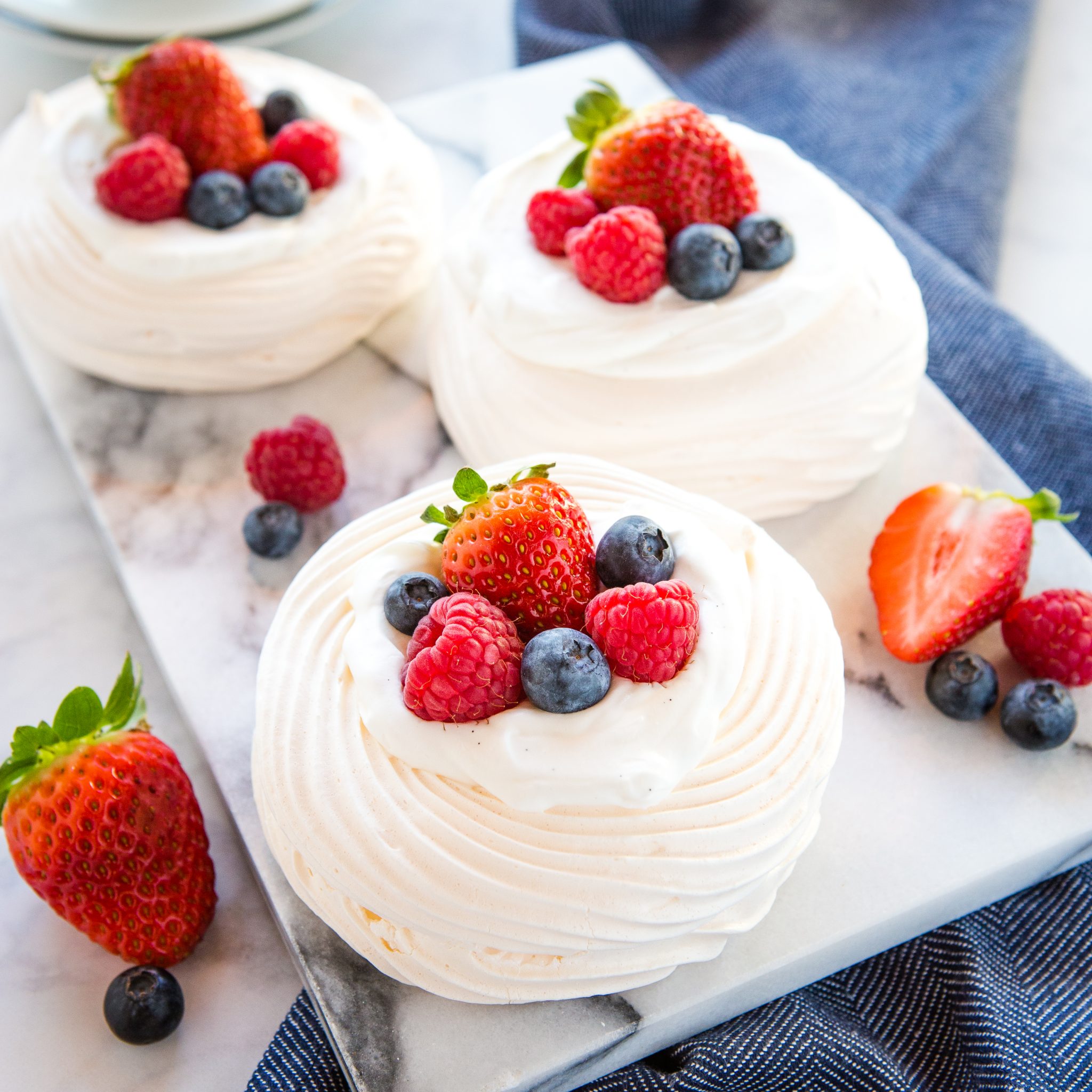 Meringue Nests with Berries and Vanilla Cream - The Busy Baker