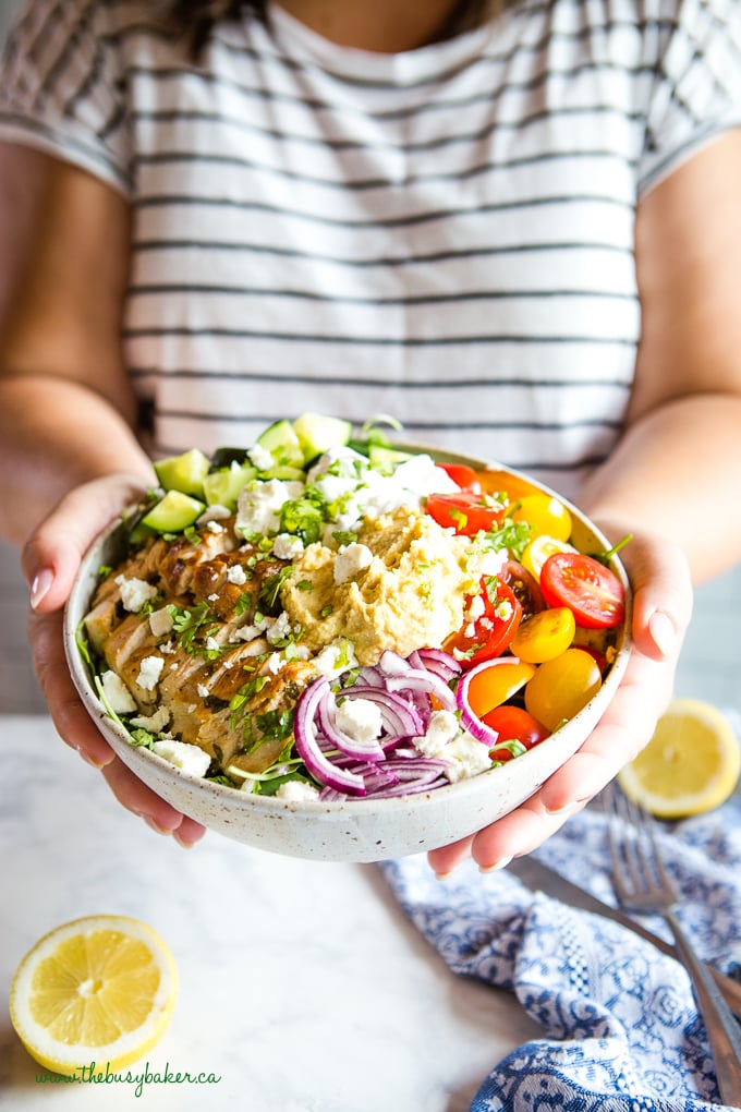 Woman holding Low Carb Chicken Shawarma Bowl in hands