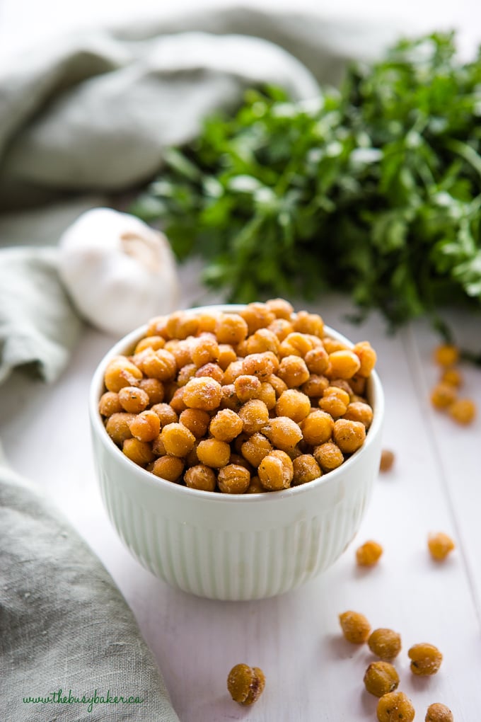 ranch roasted chickpeas in green bowl with herbs and garlic