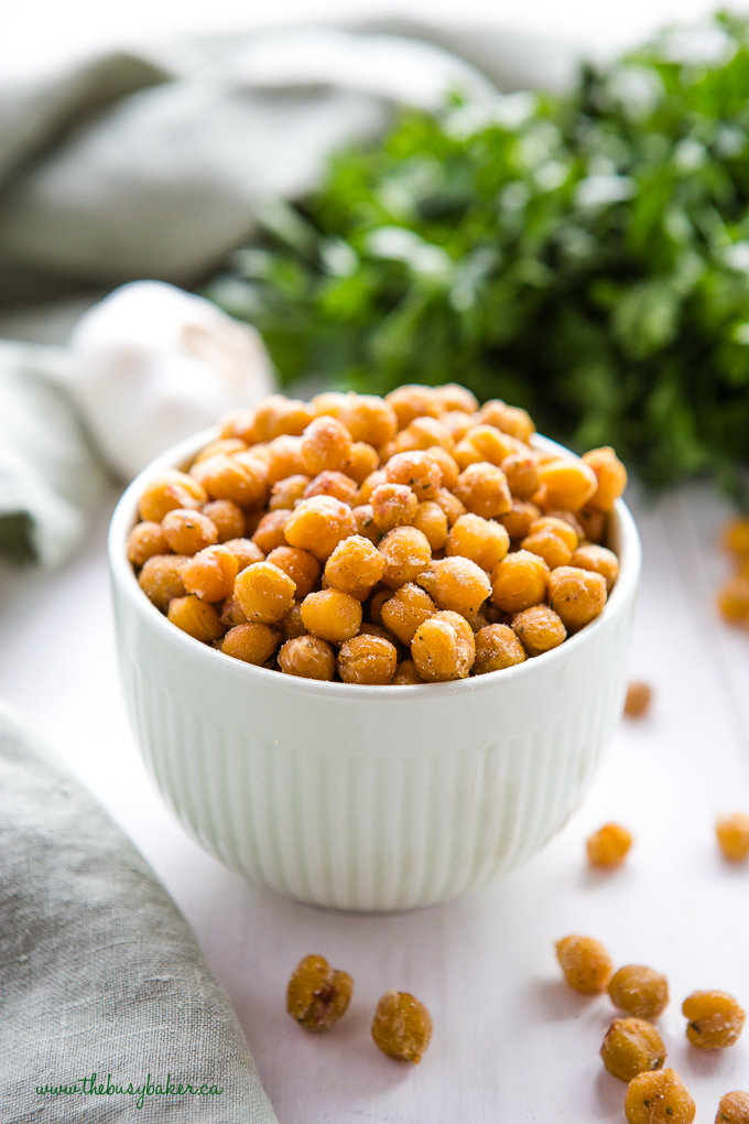 ranch roasted chickpeas in green bowl with herbs