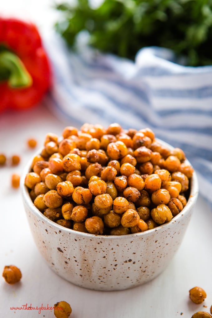 barbecue roasted chickpeas in pottery bowl with herbs
