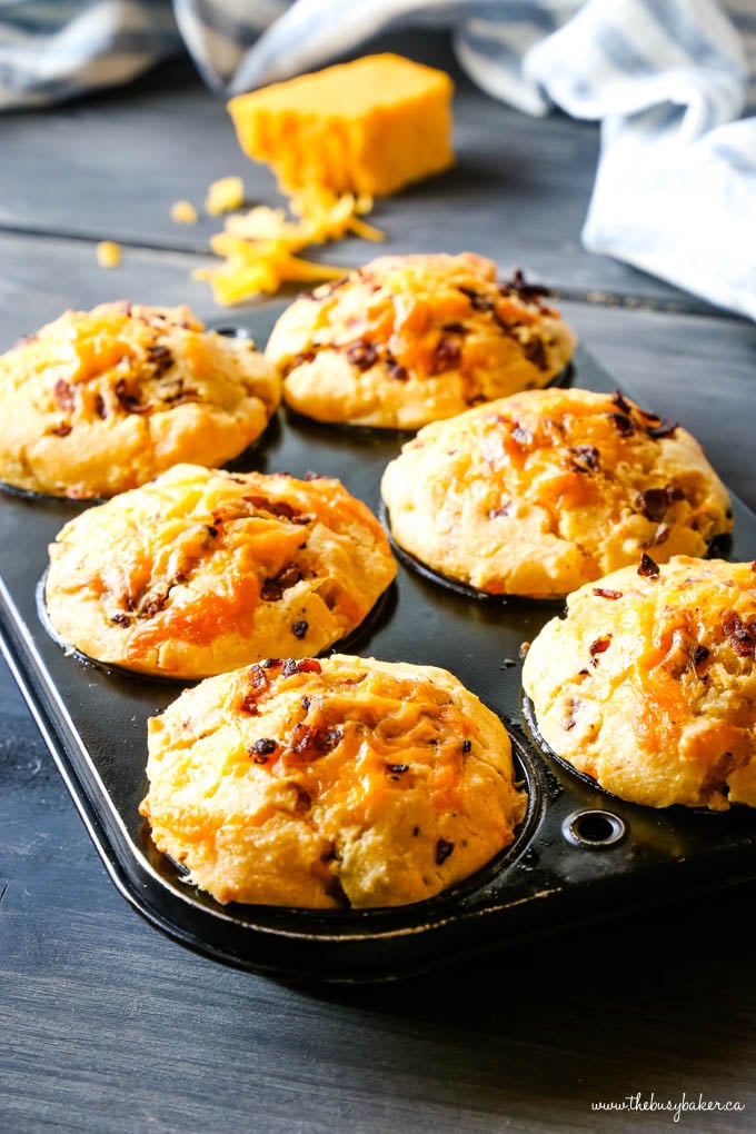 cornbread muffins with cheese in muffin tin